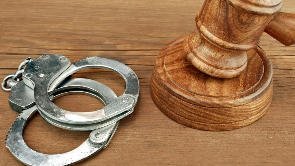 636015888771296178 handcuffs gavel